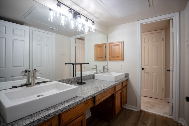 1311 Antoine Dr Unit 245, Houston, TX 77055 - full bathroom featuring visible vents, a sink, wood finished floors, and double vanity