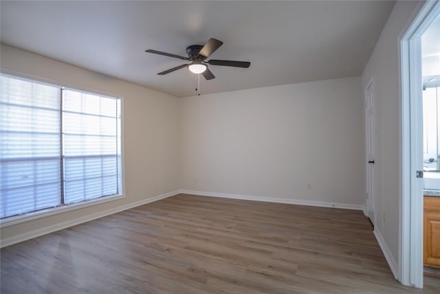 1311 Antoine Dr Unit 245, Houston, TX 77055 - unfurnished room with baseboards, ceiling fan, and light wood finished floors