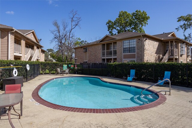 1311 Antoine Dr Unit 245, Houston, TX 77055 - community pool featuring a patio and fence
