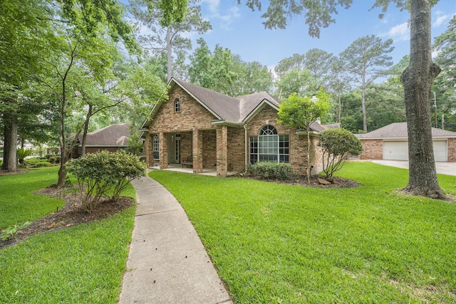 ranch-style house with brick siding and a front yard