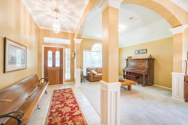 entryway featuring arched walkways, decorative columns, and light tile patterned flooring