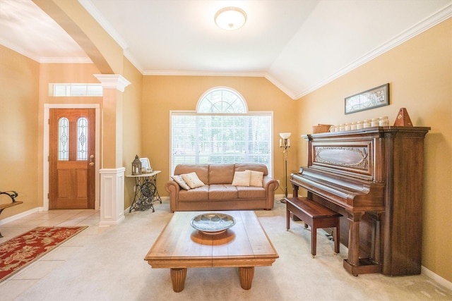 living room with decorative columns, light colored carpet, arched walkways, baseboards, and ornamental molding
