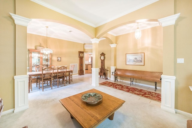 carpeted living area featuring crown molding, baseboards, ornate columns, arched walkways, and a notable chandelier