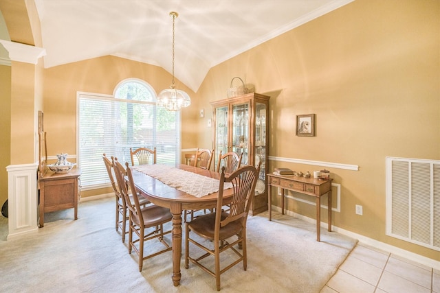 dining room with an inviting chandelier, baseboards, vaulted ceiling, and visible vents