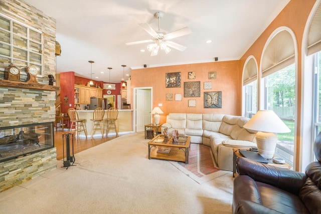 living area with recessed lighting, ceiling fan, light colored carpet, and ornamental molding