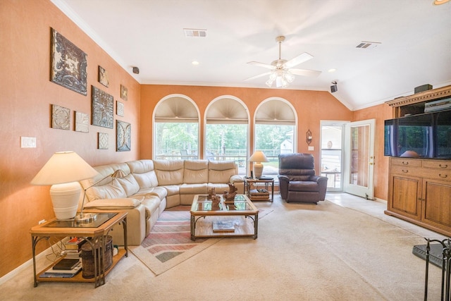 living room featuring crown molding, carpet floors, ceiling fan, and visible vents
