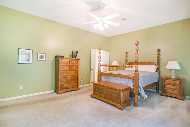 bedroom with a ceiling fan, baseboards, light colored carpet, and visible vents