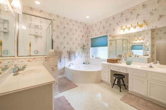 full bathroom featuring a garden tub, a sink, a stall shower, and wallpapered walls