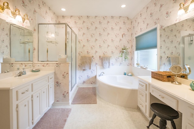 bathroom with a garden tub, a shower stall, and wallpapered walls