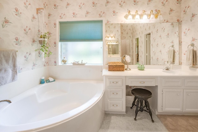 bathroom featuring tile patterned flooring, a bath, and wallpapered walls