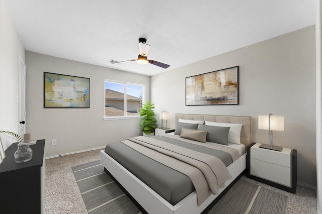bedroom with a ceiling fan, baseboards, and dark carpet