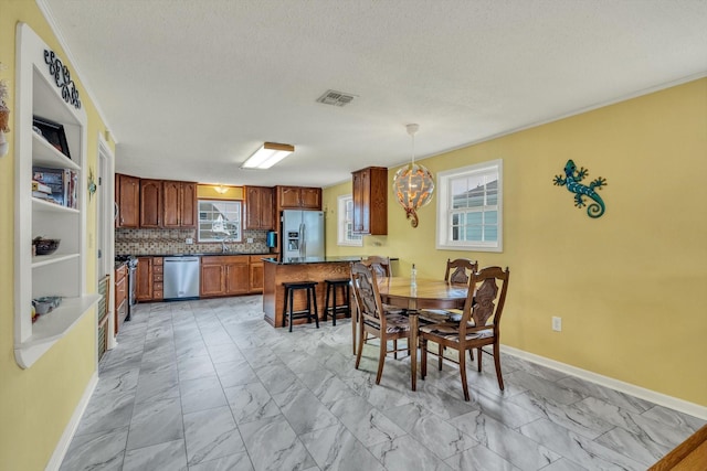 dining room featuring baseboards, visible vents, an inviting chandelier, and marble finish floor