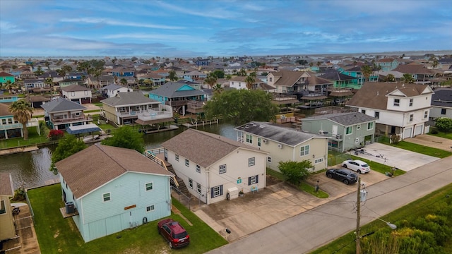 birds eye view of property featuring a residential view and a water view