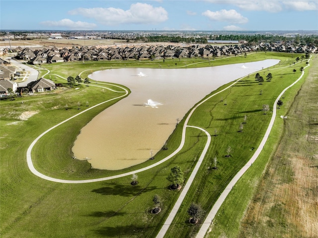 drone / aerial view with a water view and a residential view