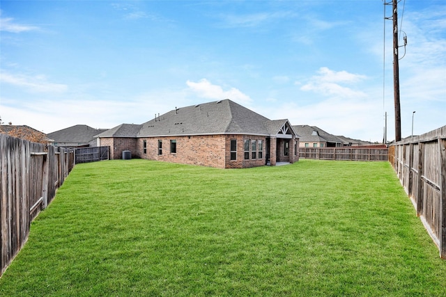 view of yard with a fenced backyard