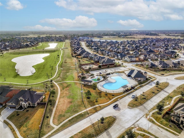 drone / aerial view featuring a residential view and a water view