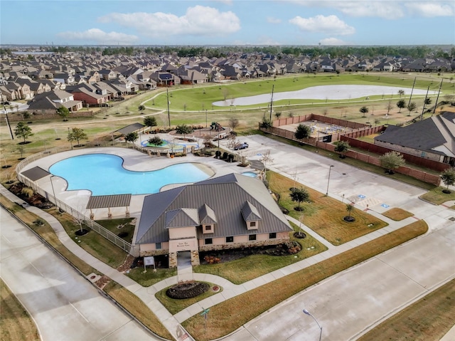 bird's eye view featuring a water view, a residential view, and golf course view