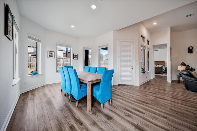 dining area featuring baseboards, recessed lighting, wood finished floors, and visible vents