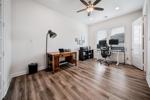 office space featuring a ceiling fan, baseboards, recessed lighting, wood finished floors, and visible vents
