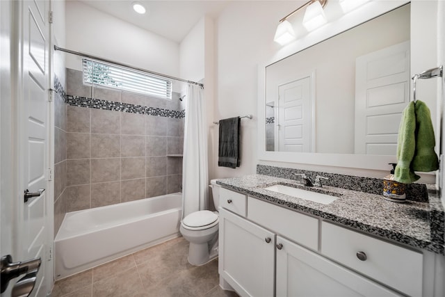 full bath featuring toilet, tile patterned flooring, shower / bath combo, and vanity