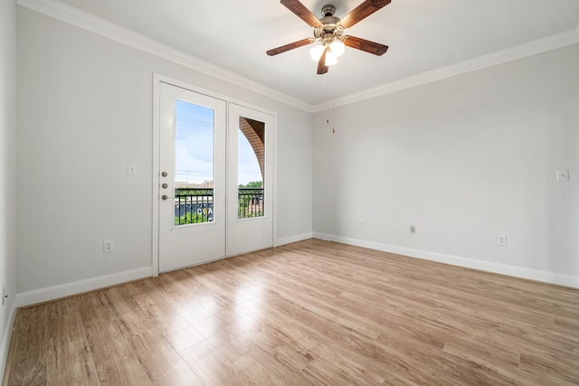 empty room featuring ceiling fan, baseboards, ornamental molding, and light wood-style flooring