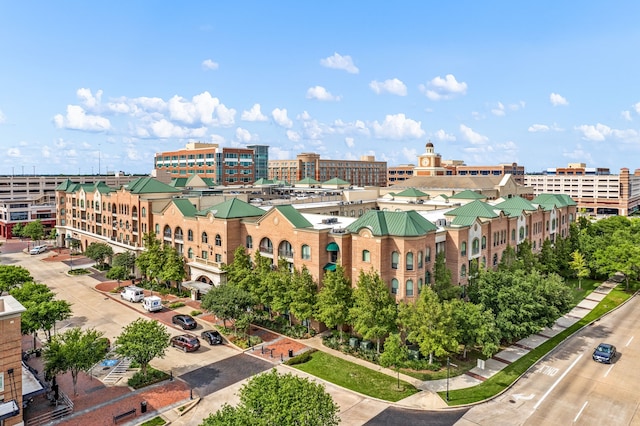 birds eye view of property featuring a city view