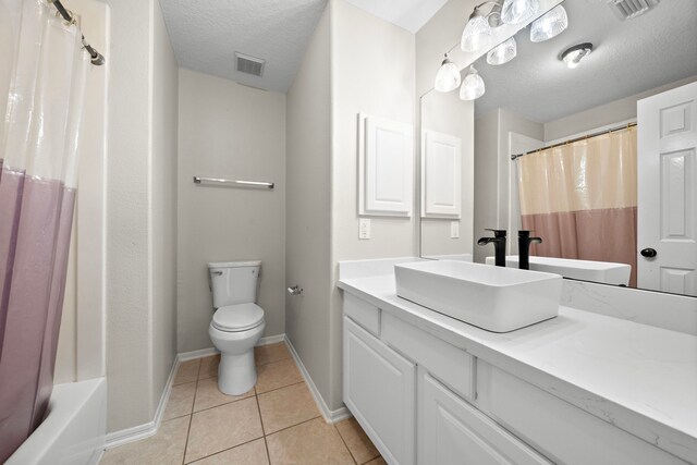 3615 Caleb Ln, Missouri City, TX 77459 - full bath featuring toilet, a textured ceiling, tile patterned floors, baseboards, and vanity