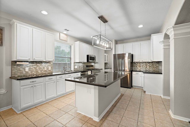 3615 Caleb Ln, Missouri City, TX 77459 - kitchen featuring stainless steel appliances, a sink, tasteful backsplash, light tile patterned floors, and recessed lighting
