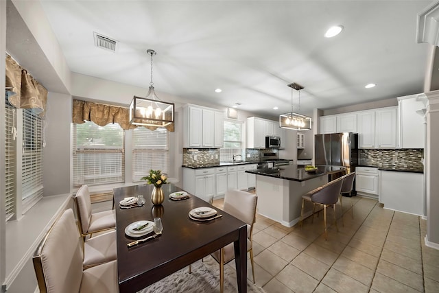 3615 Caleb Ln, Missouri City, TX 77459 - kitchen with appliances with stainless steel finishes, a chandelier, backsplash, and recessed lighting