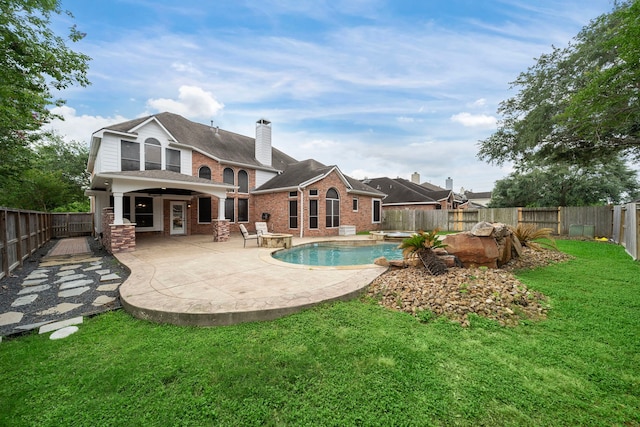 3615 Caleb Ln, Missouri City, TX 77459 - back of property with brick siding, a patio, and a chimney