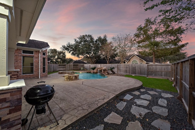 3615 Caleb Ln, Missouri City, TX 77459 - pool at dusk with a patio, a fenced backyard, an outdoor fire pit, and a grill