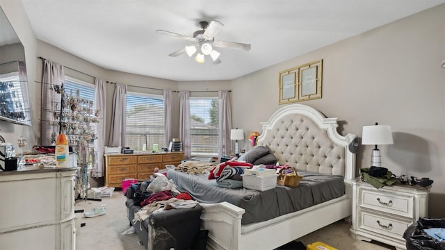 carpeted bedroom with a ceiling fan