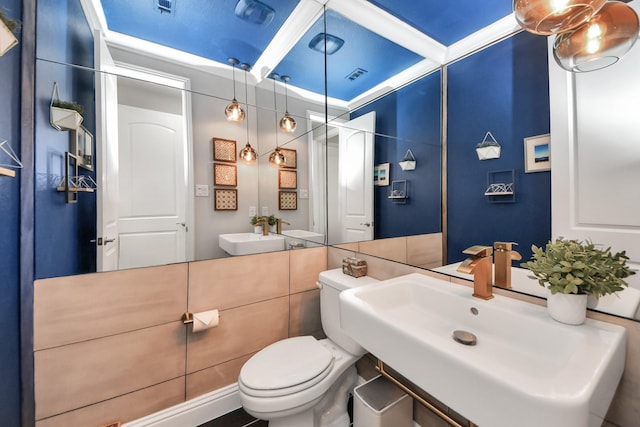 bathroom featuring a sink and toilet