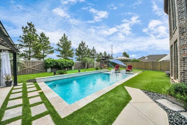 view of swimming pool with a patio area