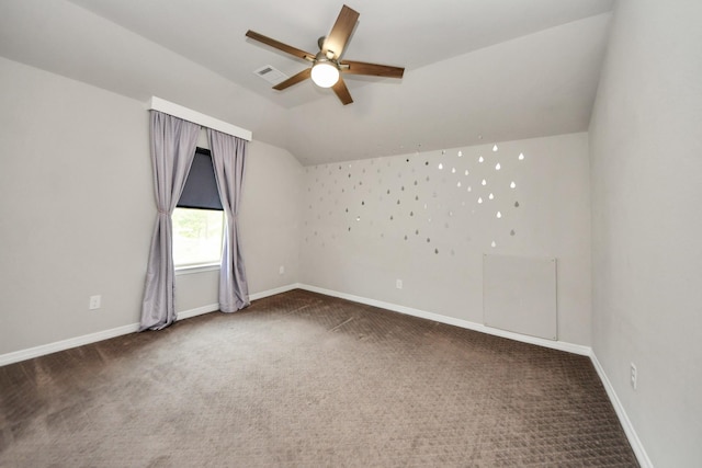 additional living space with carpet floors, lofted ceiling, a ceiling fan, and baseboards