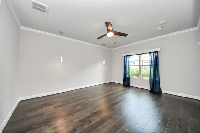 empty room featuring dark wood-style flooring, crown molding, baseboards, and a ceiling fan
