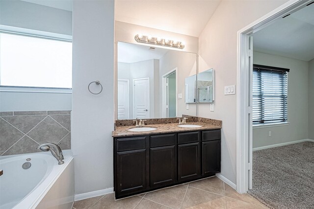 9154 Sunlight Oak Ln, Houston, TX 77070 - bathroom with a sink, tile patterned floors, a garden tub, and double vanity