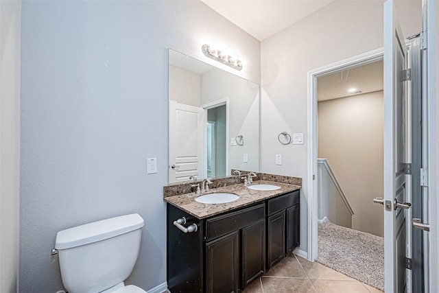 9154 Sunlight Oak Ln, Houston, TX 77070 - bathroom featuring a sink, tile patterned flooring, toilet, and double vanity