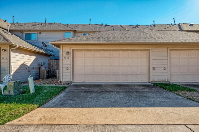 9154 Sunlight Oak Ln, Houston, TX 77070 - garage featuring cooling unit