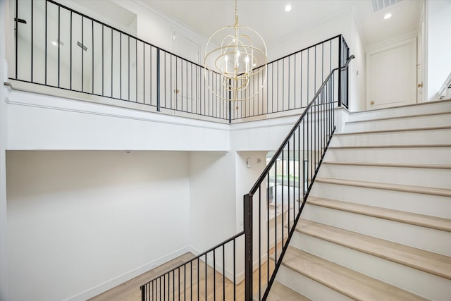 1016 Alexander St, Houston, TX 77008 - staircase featuring wood finished floors, a chandelier, recessed lighting, and baseboards