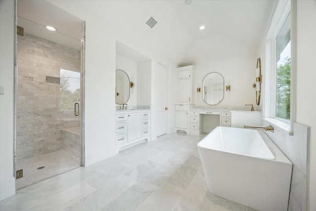 1016 Alexander St, Houston, TX 77008 - bathroom with a stall shower, vanity, a freestanding bath, lofted ceiling, and recessed lighting