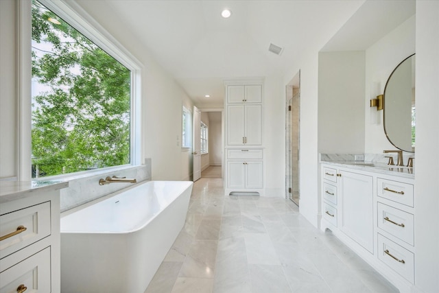 1016 Alexander St, Houston, TX 77008 - bathroom featuring a shower stall, vanity, a freestanding tub, marble finish floors, and recessed lighting