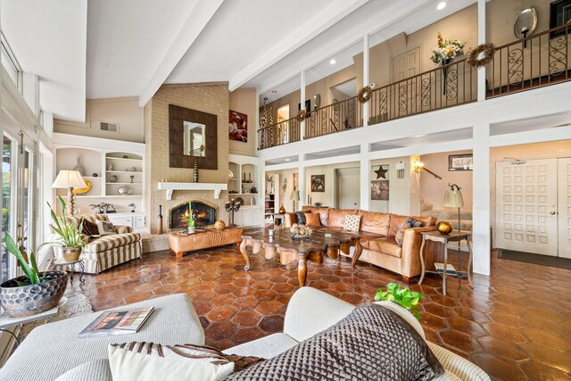 6303 Pebble Beach Dr, Houston, TX 77069 - living room featuring a fireplace, high vaulted ceiling, built in features, beamed ceiling, and visible vents