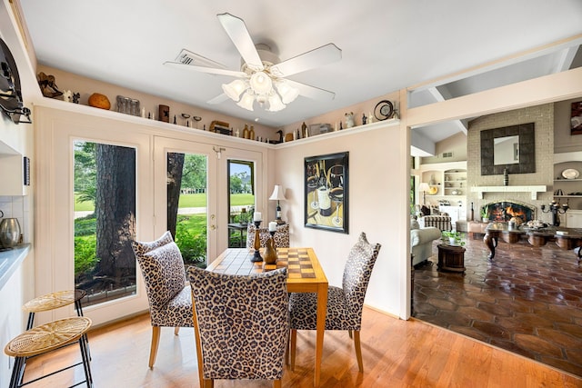 6303 Pebble Beach Dr, Houston, TX 77069 - dining room featuring a fireplace and a ceiling fan