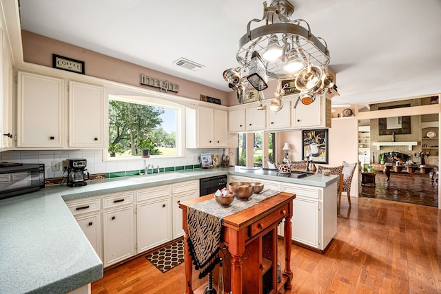 6303 Pebble Beach Dr, Houston, TX 77069 - kitchen featuring light countertops, visible vents, a sink, and tasteful backsplash