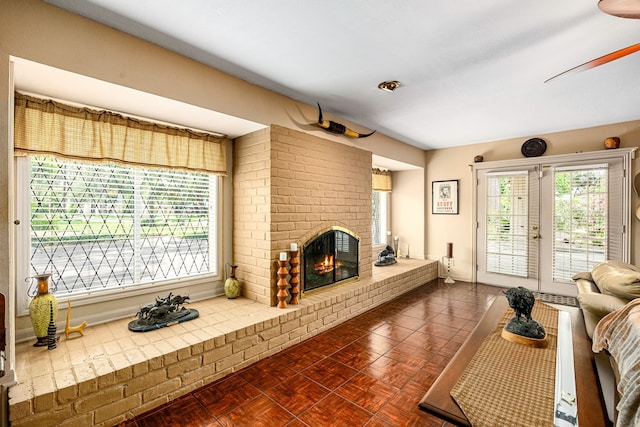 6303 Pebble Beach Dr, Houston, TX 77069 - living area featuring a brick fireplace and ceiling fan