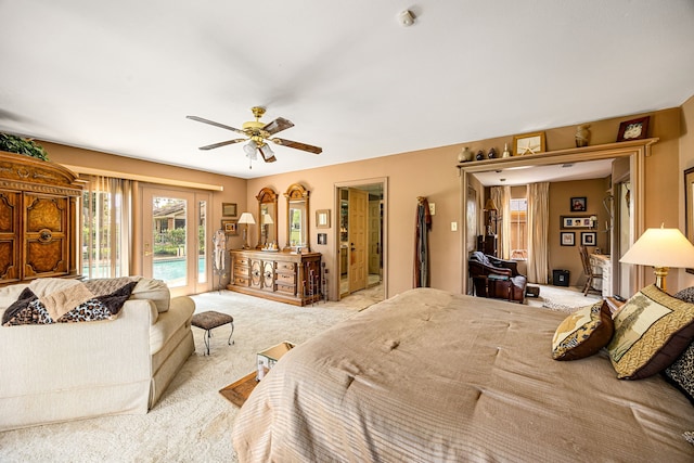 6303 Pebble Beach Dr, Houston, TX 77069 - bedroom with access to outside, a ceiling fan, and light carpet