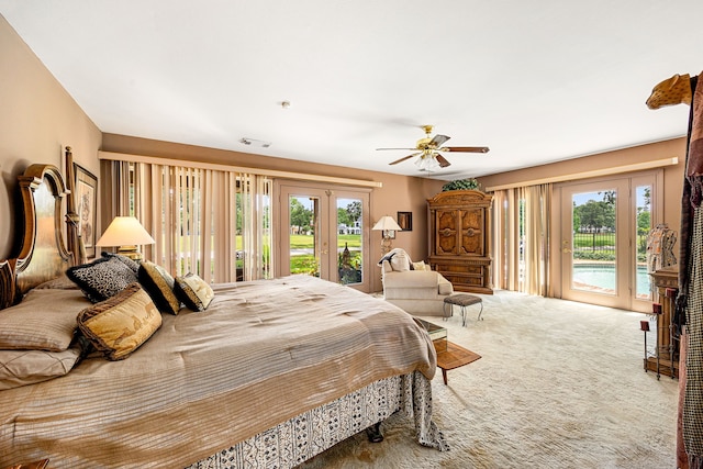 6303 Pebble Beach Dr, Houston, TX 77069 - bedroom featuring access to outside, multiple windows, french doors, and carpet