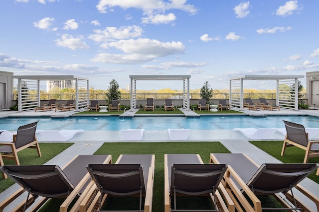 view of pool with stairway, a fenced in pool, a fenced backyard, and an outdoor hangout area