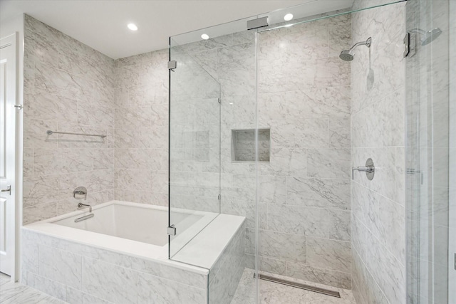 full bathroom featuring recessed lighting, tiled tub, and a tile shower